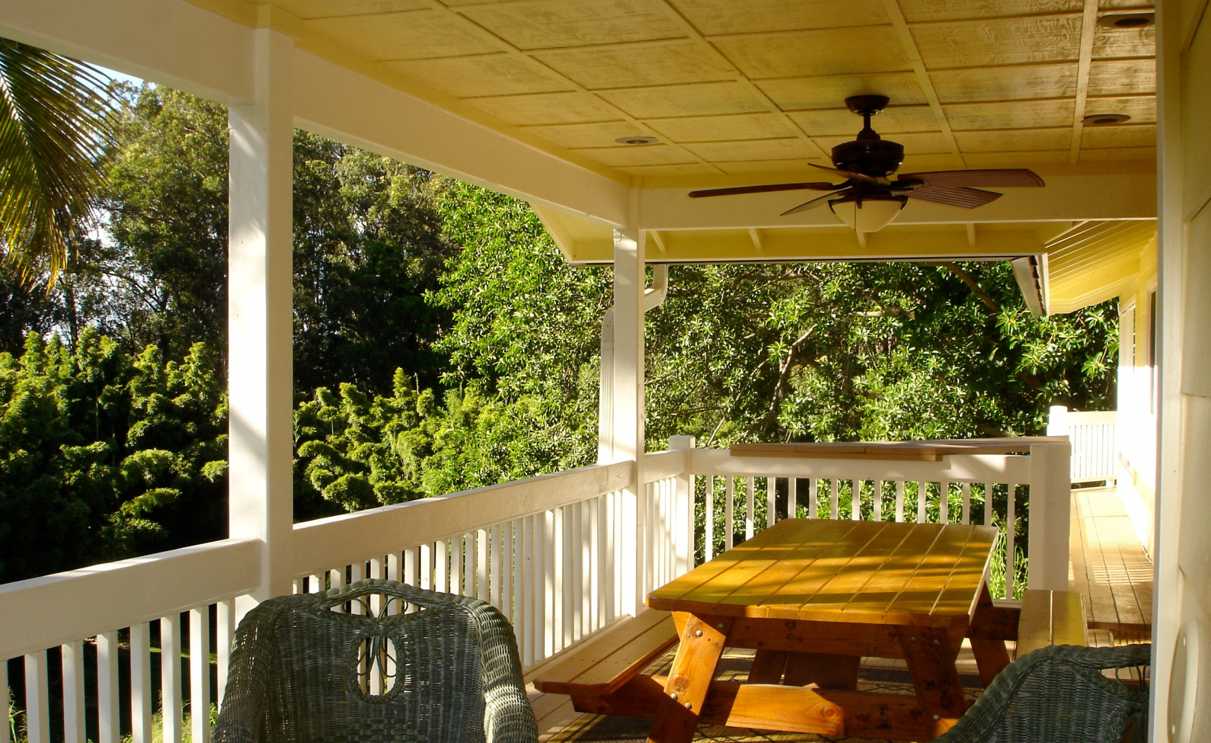 Outdoor covered lanai with gas grill.